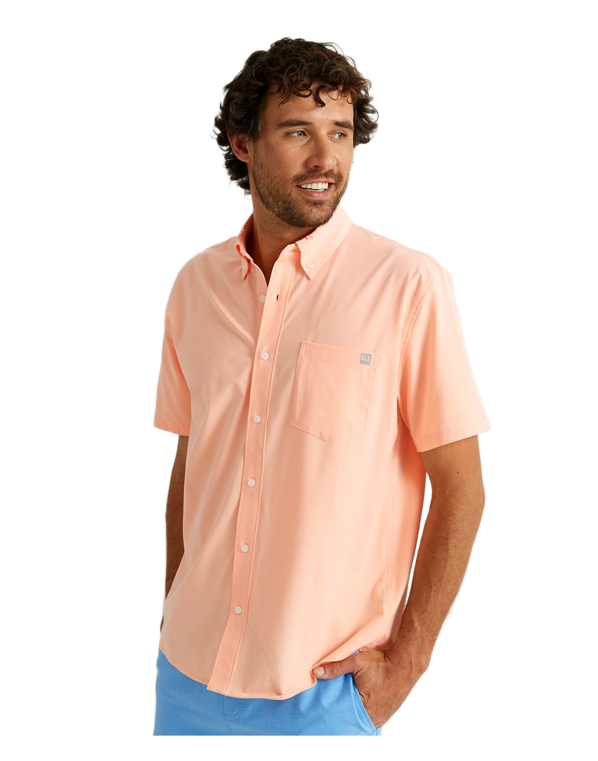 Image of Huk Kona Solid Short-Sleeve Button-Down Shirt for Men - Peach Nectar