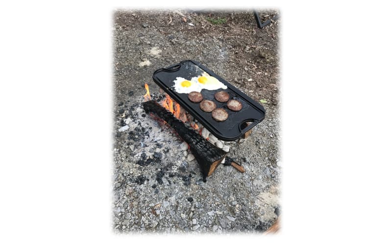 Lodge Reversible Pro Grid Iron Grill/Griddle on a glass-top stove