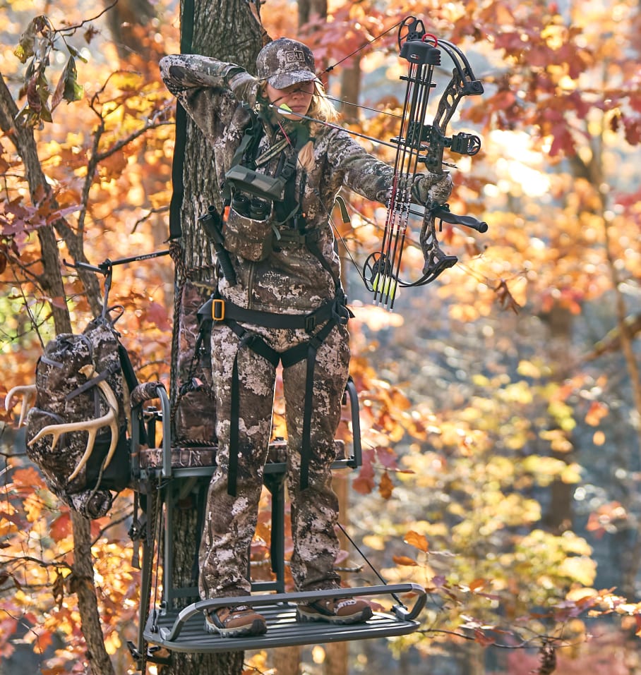 Woman in treestand with Faze Bow