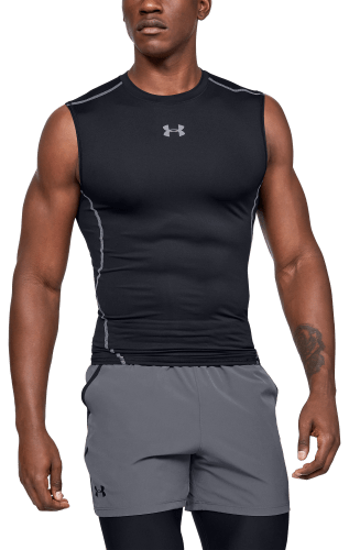 Muscular Man in Black Compression Sportswear on Gray Background