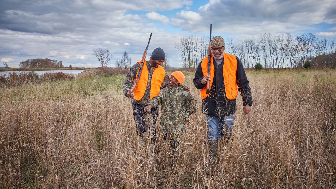 Family hunting in a prairie.