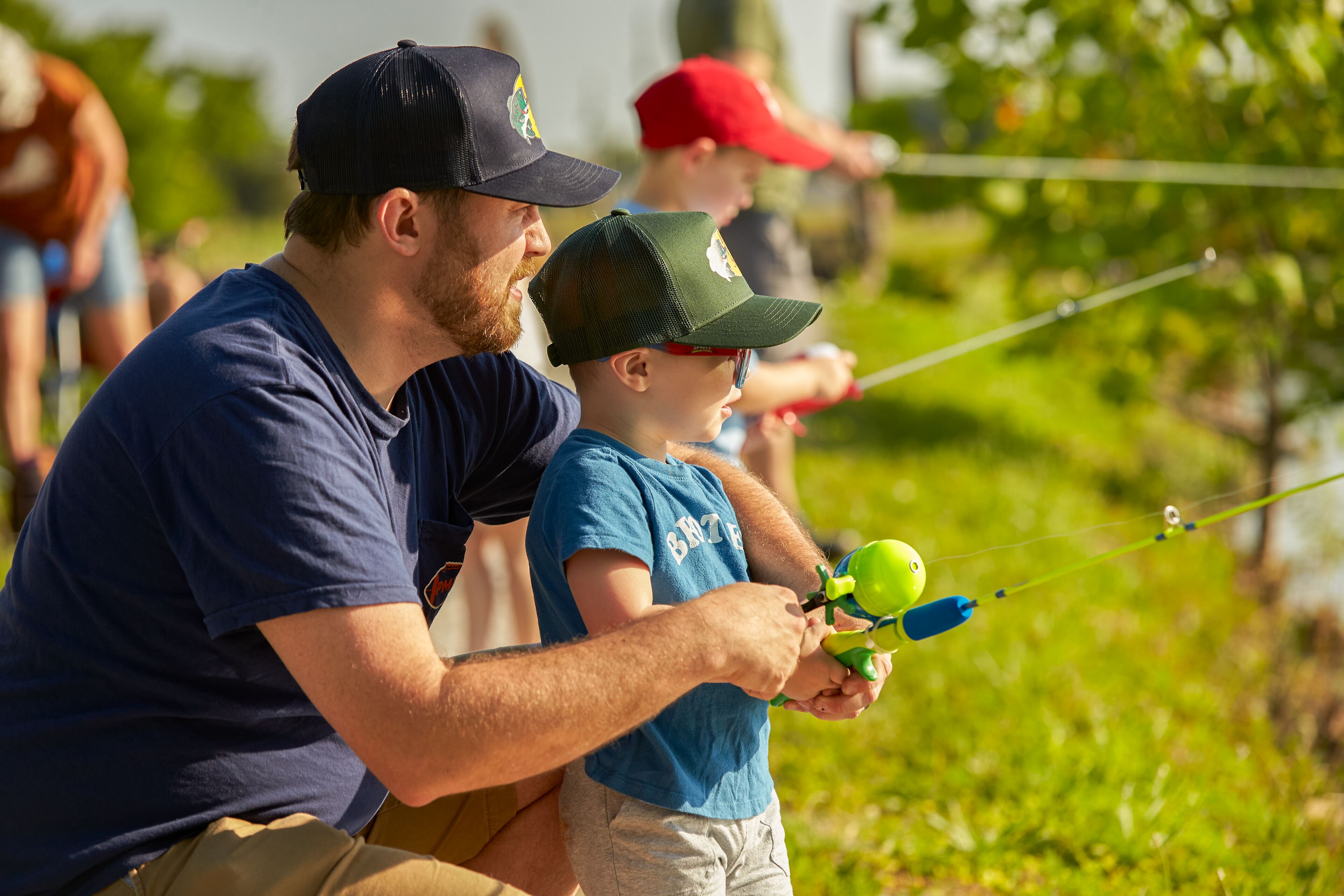 Father fishing with his son.