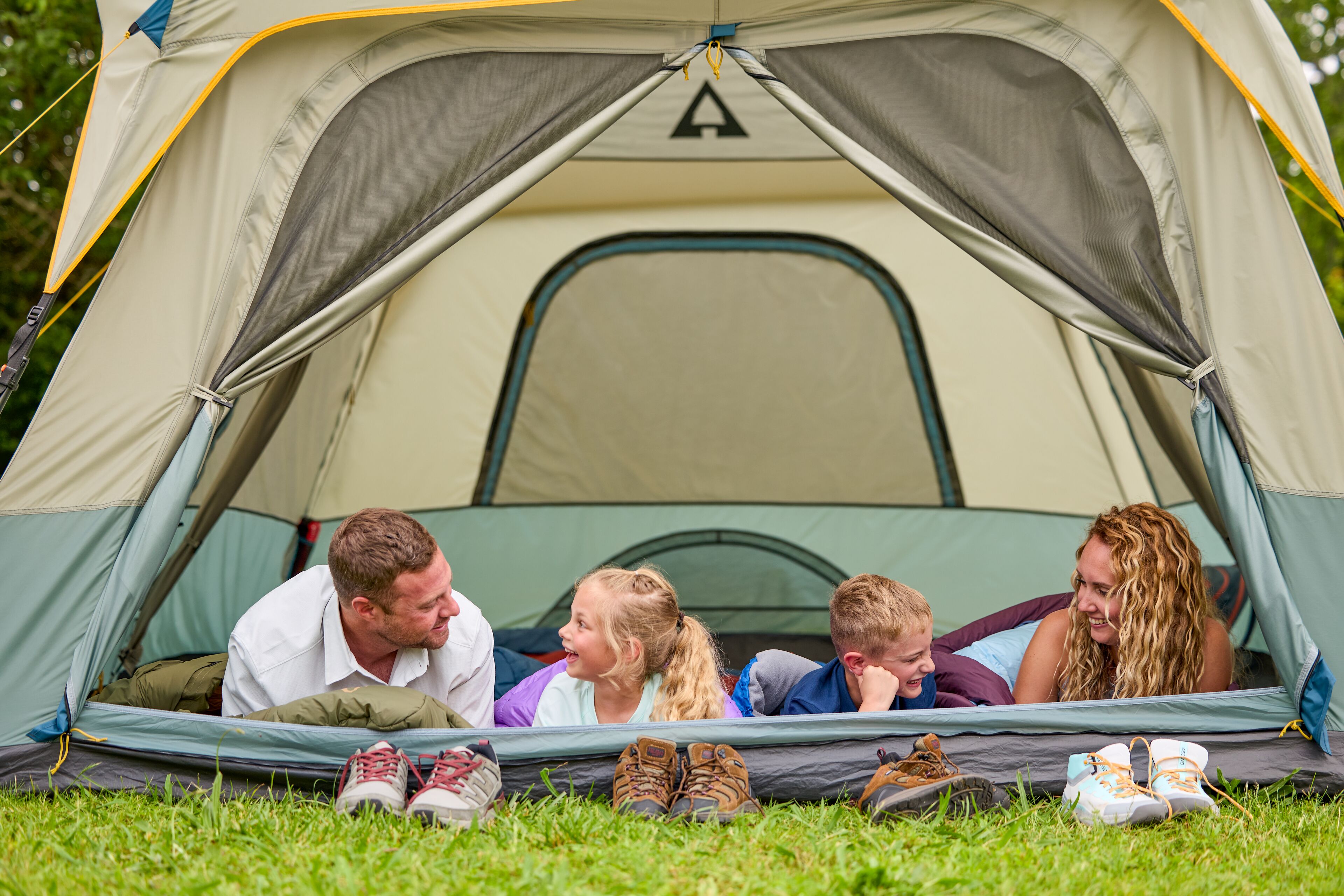 Family Enjoying the Easy Setup of an Ascend Lighted Instant Cabin Tent