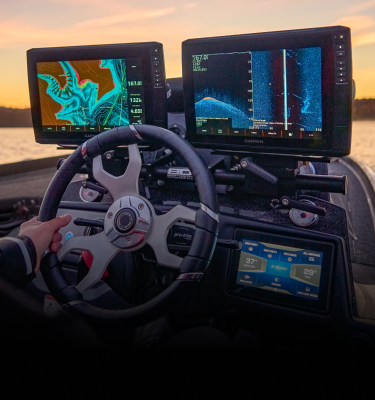 Man looking at fish finder on the water