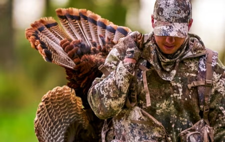 A hunter with a turkey.